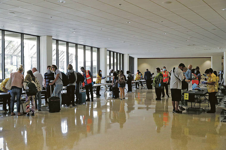 JAMM AQUINO / OCT. 15
                                A new California travel advisory could mean fewer visitors from that state coming to Hawaii. Above, travelers are screened after arriving on trans-Pacific flights at Daniel K. Inouye International Airport.