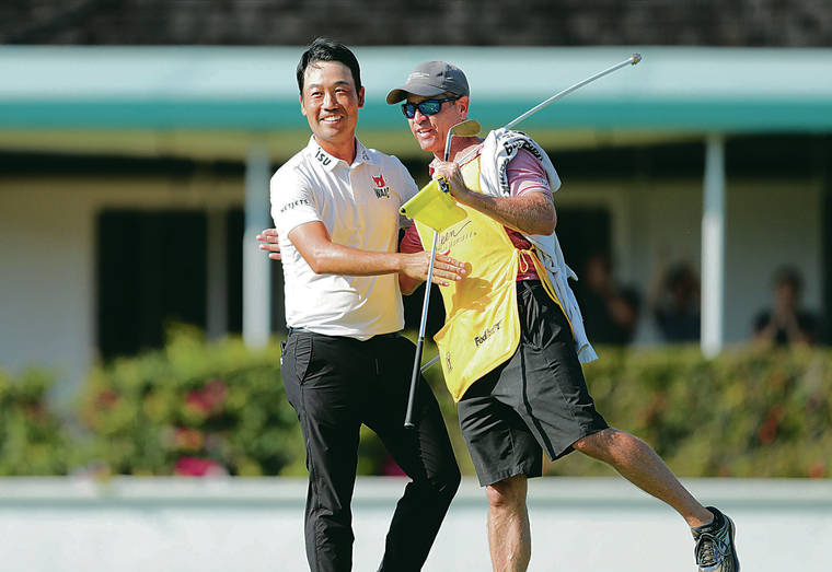JAMM AQUINO/JAQUINO@STARADVERTISER.COM 
                                Kevin Na, left, embraces caddie Kenneth Harms after winning the final round of the Sony Open golf tournament Sunday, Jan. 17, 2021 at Waialae Country Club in Honolulu.