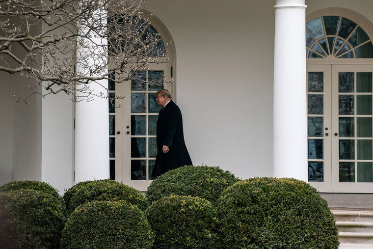 NEW YORK TIMES
                                President Donald Trump walks to the Oval Office at the White House in Washington on Thursday.