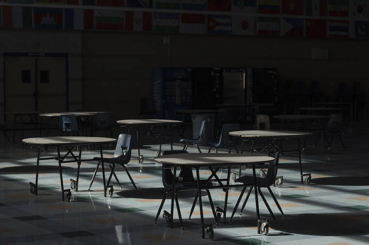 BRIDGET BENNETT/THE NEW YORK TIMES / JAN. 8
                                The vacant cafeteria of Sierra Vista High School in Las Vegas. Since the nation’s fifth-largest school district closed its doors in March, more than 3,100 alerts flooded the district headquarters through October, raising alarms about a student’s suicidal thoughts, possible self-harm or cry for care.