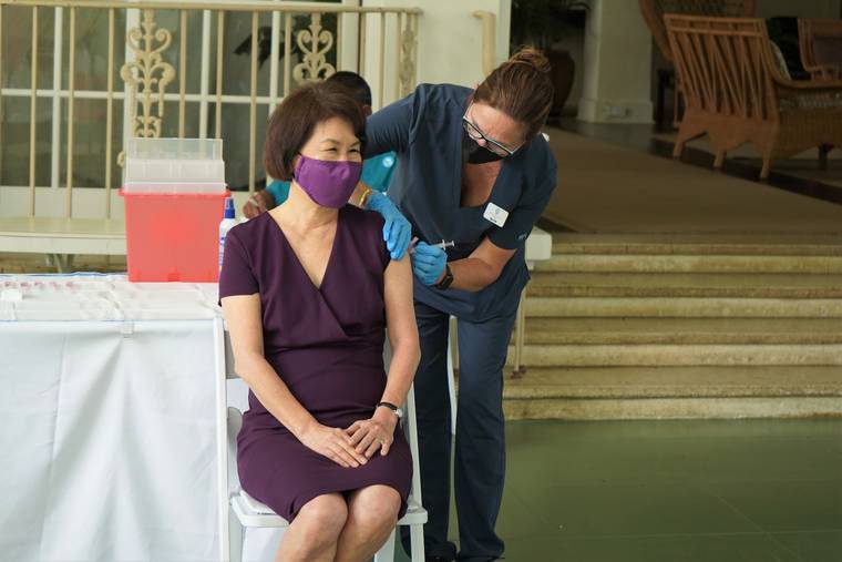 COURTESY DAVID IGE
                                First Lady Dawn Amano-Ige receives a COVID-19 vaccination at Washington Place today.