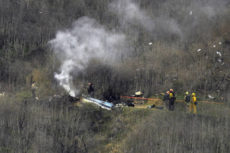 ASSOCIATED PRESS
                                Firefighters worked the scene of a helicopter crash, on Jan. 26, 2020, in Calabasas, Calif. The helicopter pilot who crashed into a Southern California hillside last year, killing Kobe Bryant and seven other passengers, went against his training and violated flight rules by flying into thick clouds, U.S. safety officials said today.