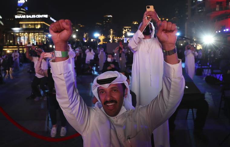ASSOCIATED PRESS
                                Emiratis celebrated after the Hope Probe entered Mars orbit as a part of Emirates Mars mission, in Dubai, United Arab Emirates, today. The spacecraft from the United Arab Emirates swung into orbit around Mars in a triumph for the Arab world’s first interplanetary mission.