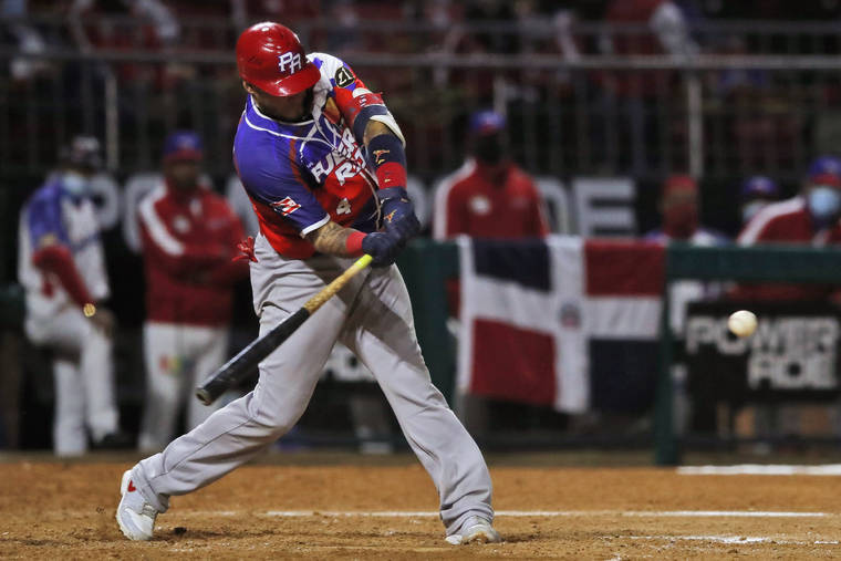 ASSOCIATED PRESS
                                Puerto Rico’s Yadier Molina bats during the third inning against the Dominican Republic in the Caribbean Series baseball final at Teodoro Mariscal stadium in Mazatlan, Mexico, on Feb. 6.