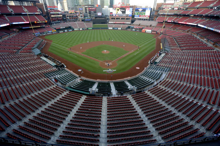 ASSOCIATED PRESS
                                Empty seats are viewed in Busch Stadium as St. Louis Cardinals starting pitcher Jack Flaherty throws in the first inning baseball game against the Pittsburgh Pirates in St. Louis in July. Major League Baseball players rejected a proposal to delay the start of spring training and the season due to the coronavirus pandemic, vowing to report under the original schedule.