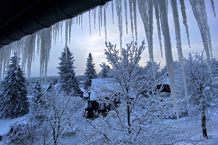 ASSOCIATED PRESS
                                Icicles form on a window outside a house early morning in Altenberg, Germany, Wednesday.