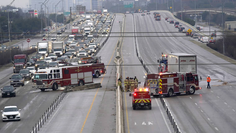 ASSOCIATED PRESS
                                The highway sat closed as emergency crews finished cleaning following accidents caused by ice and low temperatures in Richardson, Texas, today. A winter storm brought a coating of ice to parts of Texas.