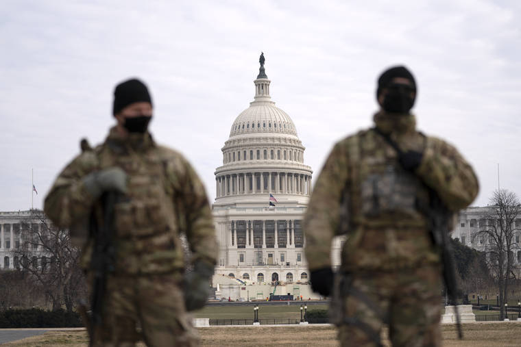 ASSOCIATED PRESS
                                Members of the national guard patrolled the area outside of the U.S. Capitol, Wednesday, during the impeachment trial of former President Donald Trump at the Capitol in Washington.