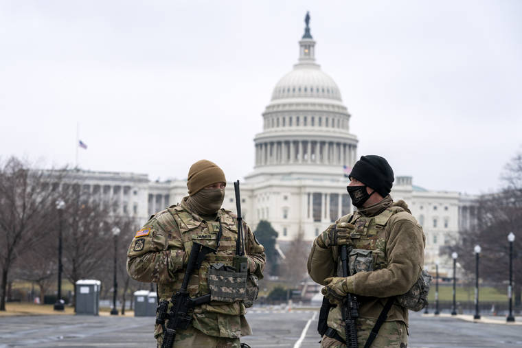 ASSOCIATED PRESS
                                Members of the National Guard patrol the area outside of the U.S. Capitol on the third day of the second impeachment trial of former President Donald Trump, on Capitol Hill in Washington today.