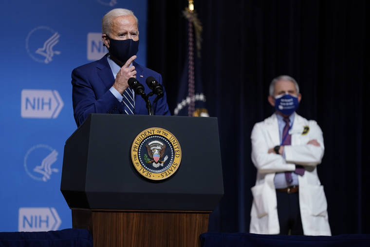 ASSOCIATED PRESS
                                President Joe Biden speaks during a visit to the Viral Pathogenesis Laboratory at the National Institutes of Health today in Bethesda, Md. Dr. Anthony Fauci, director of the National Institute of Allergy and Infectious Diseases, listens at right.