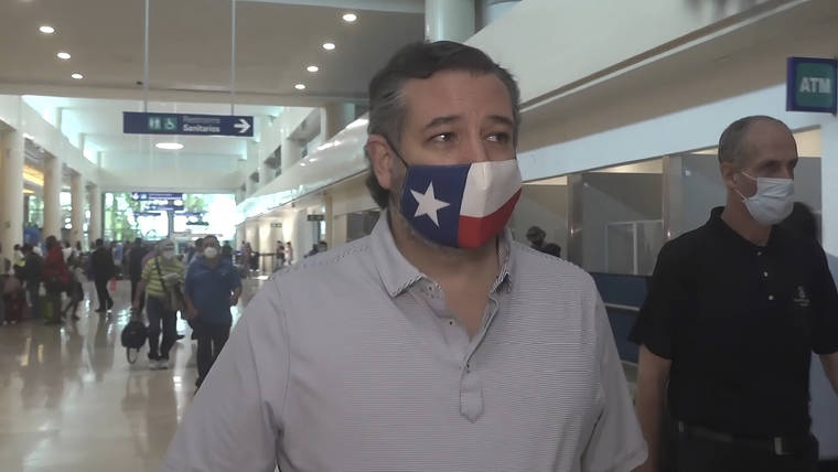 ASSOCIATED PRESS In this image from video, Sen. Ted Cruz, R-Texas, walks to check in for his flight back to the U.S., at Cancun International Airport in Cancun, Mexico.