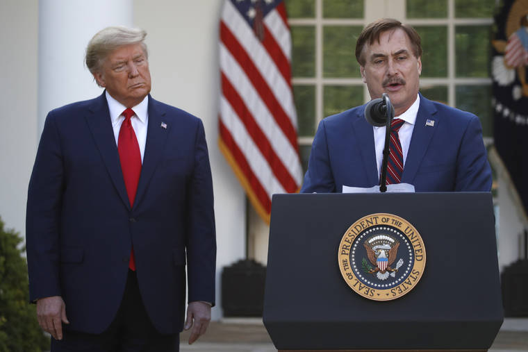 ASSOCIATED PRESS\
                                My Pillow CEO Mike Lindell spoke, March 30, as President Donald Trump listened during a briefing about the coronavirus in the Rose Garden of the White House, in Washington. Dominion Voting Systems filed a $1.3 billion defamation lawsuit Monday against the founder and CEO of Minnesota-based MyPillow, saying that Mike Lindell falsely accused the company of rigging the 2020 presidential election.