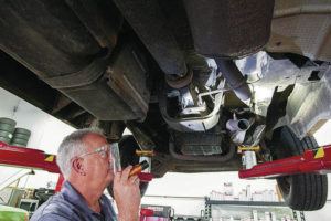 CINDY ELLEN RUSSELL / CRUSSELL@STARADVERTISER.COM
                                Capitol Auto Services general manager Phillip Fox showed where thieves removed the catalytic converter from a Dodge van, which was undergoing repairs at the Waipio shop on Wednesday.