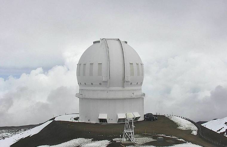 CANADA-FRANCE-HAWAII TELESCOPE
                                Snow was seen on the ground this morning outside the Canada-France-Hawaii Telescope atop Mauna Kea.