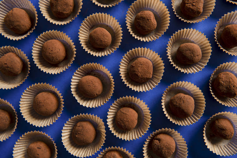 NEW YORK TIMES
                                Enticingly imperfect, hand-rolled truffles are a one-bite affair.