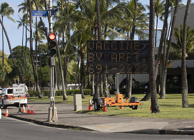 CINDY ELLEN RUSSELL / CRUSSELL@STARADVERTISER.COM
                                An electronic message display sign provides the public with COVID-19 vaccination information Wednesday at the Neal S. Blaisdell Center where vaccinations are being held by The Queen’s Health Systems.