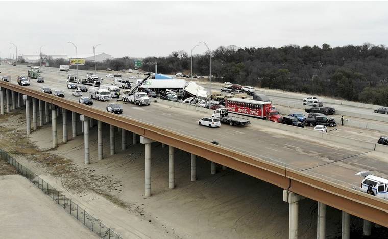 AMANDA MCCOY /STAR-TELEGRAM VIA ASSOCIATED PRESS
                                First responders worked the scene of a fatal crash on I-35 near downtown Fort Worth, today. Police said some people were killed and dozens injured in a massive crash involving 75 to 100 vehicles on an icy Texas interstate.