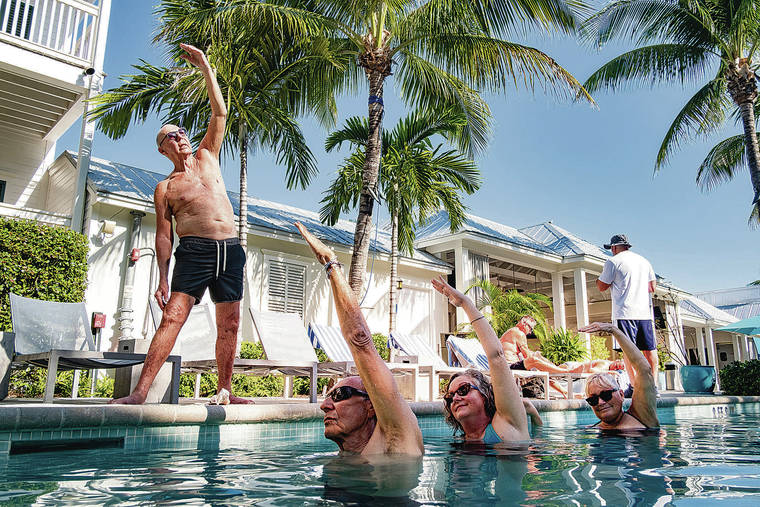 NEW YORK TIMES
                                Across the United States, older people have been among the first in line to receive their COVID-19 vaccinations, and data shows older travelers are leading a wave in new travel bookings. Peter Rogers teaches an aqua yoga class at the Marker Key West Harbor Resort in Key West, Fla.
