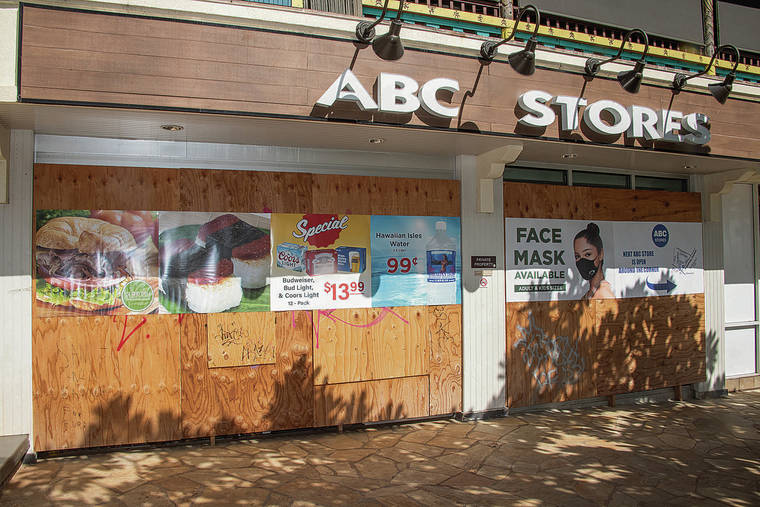 CRAIG T. KOJIMA / FEB. 10
                                A boarded-up ABC store at 2586 Kala­kaua Ave. in Waikiki is just a small sampling of how the COVID-19 pandemic is affecting retail.