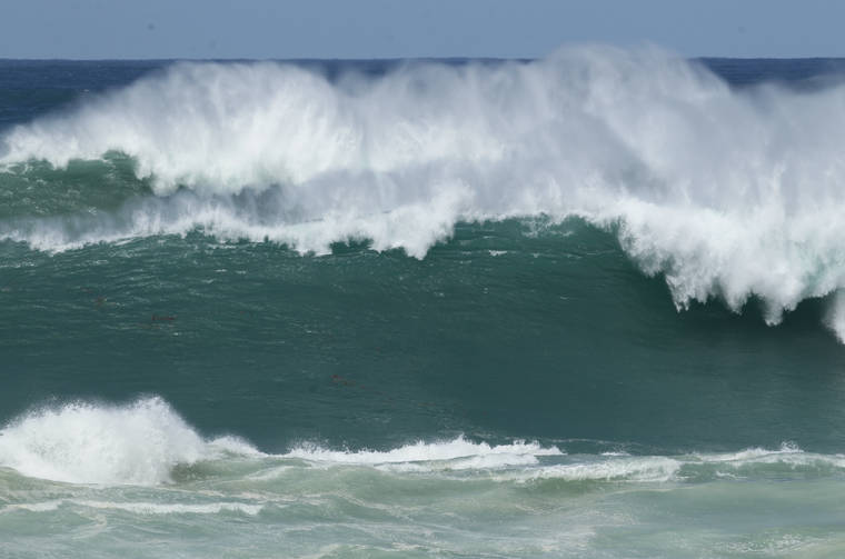Warning in place as surfers rise to 35 feet along the northern, western shores of smaller islands