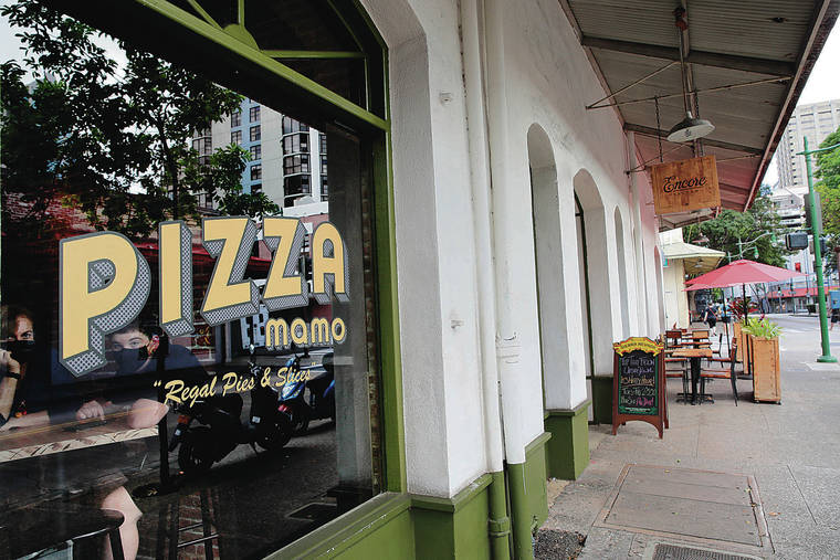 JAMM AQUINO / JAQUINO@STARADVERTISER.COM
                                Diners sit inside Pizza Mamo restaurant as an outdoor dining area of Fete is seen along Hotel Street on Tuesday in downtown Honolulu.