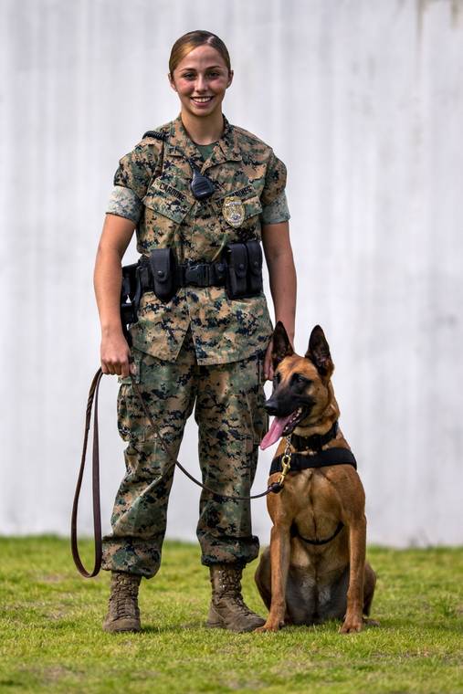 COURTESY PHOTO
                                Sgt. Angela Cardone with Bogi as a working military dog.