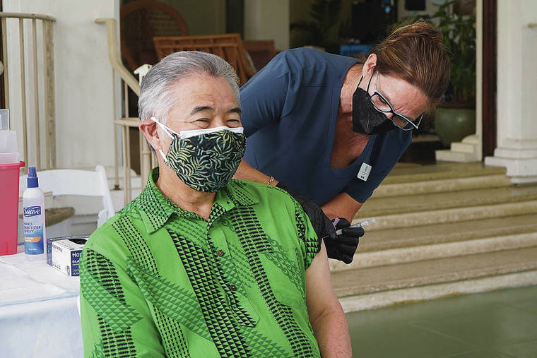 COURTESY GOVERNOR’S OFFICE
                                Gov. David Ige received his COVID-19 vaccination Monday from Project Vision Hawaii Registered Nurse Toni Floerke at Washington Place. The governor and first lady delayed their shots because of the vaccine shortage.