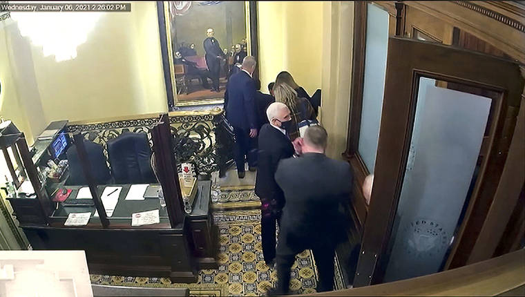 ASSOCIATED PRESS
                                A security video shows Vice President Mike Pence being evacuated on Jan. 6 as rioters breach the Capitol. The video was shown during the second impeachment trial of former President Donald Trump in the Senate at the U.S. Capitol in Washington Wednesday.