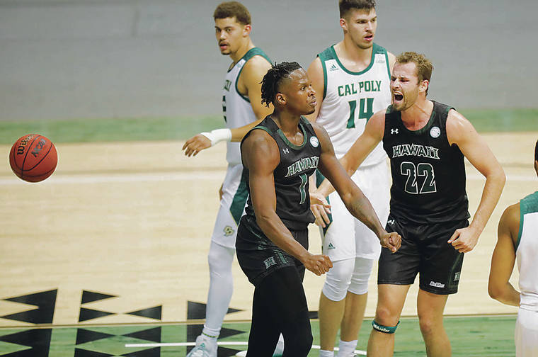 JAMM AQUINO / JAQUINO@STARADVERTISER.COM
                                Hawaii forward James Jean-Marie, left, flexed his arms with forward Casdon Jardine during the Rainbow Warriors’ win over Cal Poly on Saturday at SimpliFi Arena at Stan Sheriff Center.