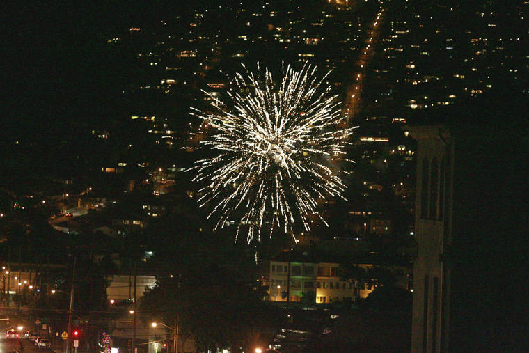 STAR-ADVERTISER / 2009 
                                Illegal aerial fireworks filled the skies over Honolulu on New Years Eve.