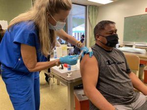 COURTESY HAWAII DEPARTMENT OF HEALTH
                                Hawaii Department of Education employee Fulton Dela Cruz receives a single-shot of the coronavirus vaccine by Johnson & Johnson today at the Windward Comprehensive Health Center in Kaneohe.