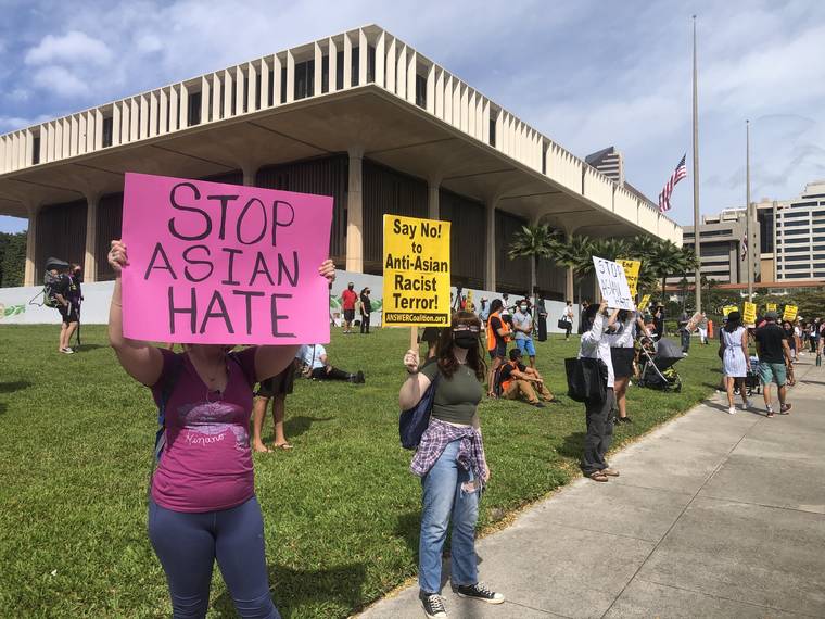 CRAIG T. KOJIMA / CKOJIMA@STARADVERTISER.COM Protesters gathered today at the Hawaii State Capitol to demonstrate against anti-Asian hatred.