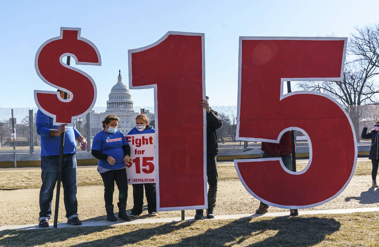 ASSOCIATED PRESS
                                Activists appealed for a $15 minimum wage near the Capitol in Washington, Thursday. The $1.9 trillion COVID-19 relief bill being prepped in Congress includes a provision that over five years would hike the federal minimum wage to $15 an hour.