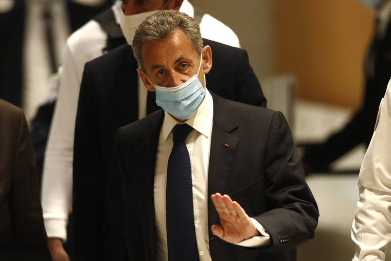 ASSOCIATED PRESS
                                Former French President Nicolas Sarkozy arrived at the courtroom, Monday, in Paris. A Paris court found French former President Nicolas Sarkozy guilty of corruption and influence peddling today and sentenced him to a year in prison. He can ask to serve that time at home and also plans to appeal.
