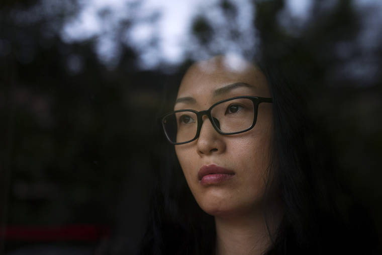 ASSOCIATED PRESS
                                Kelly Yang posed for photos, Feb. 11, in Calabasas, Calif. Yang, an author of young adult books, was verbally attacked in a California park and told to go back to her country.