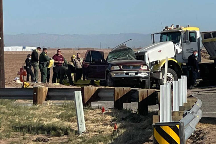 KYMA VIA ASSOCIATED PRESS
                                Law enforcement officers worked at the scene of a deadly crash involving a semitruck and an SUV in Holtville, Calif., today.