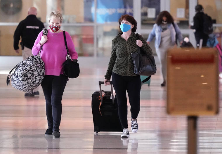 ASSOCIATED PRESS
                                To prevent the spread of COVID-19, travelers wore masks at Love Field, today, in Dallas.