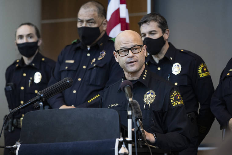LYNDA M. GONZáLEZ/THE DALLAS MORNING NEWS VIA ASSOCIATED PRESS
                                Chief Eddie García, center, spoke with media during a press conference regarding the arrest and capital murder charges against Officer Bryan Riser at the Dallas Police Department headquarters, today, in Dallas. Riser was arrested today on two counts of capital murder in two unconnected 2017 killings that weren’t related to his police work, authorities said.