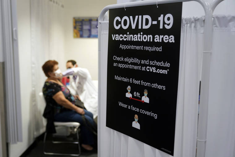 ASSOCIATED PRESS
                                A patient received a shot of the Moderna COVID-19 vaccine, March 1, next to a guidelines sign at a CVS Pharmacy branch in Los Angeles. More than 27 million Americans fully vaccinated against the coronavirus will have to keep waiting for guidance from U.S. health officials for what they should and shouldn’t do.