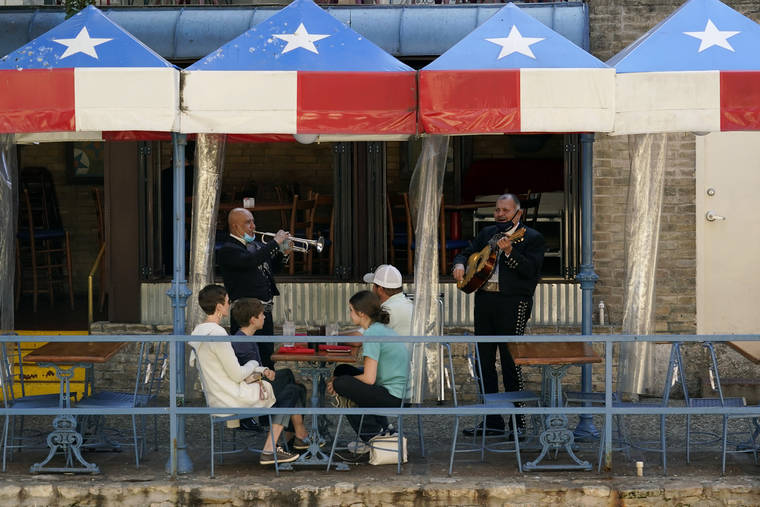 ASSOCIATED PRESS
                                Mariachi performed for diners, March 3, at a restaurant on the River Walk in San Antonio. A new national study adds strong evidence that mask mandates can slow the spread of the coronavirus, and that allowing dining at restaurants can increase cases and deaths.