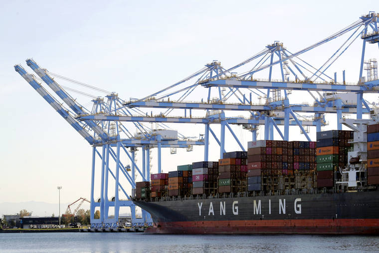 ASSOCIATED PRESS / 2019
                                Cargo cranes are used to take containers off of a Yang Ming Marine Transport Corporation boat at the Port of Tacoma in Tacoma, Wash.