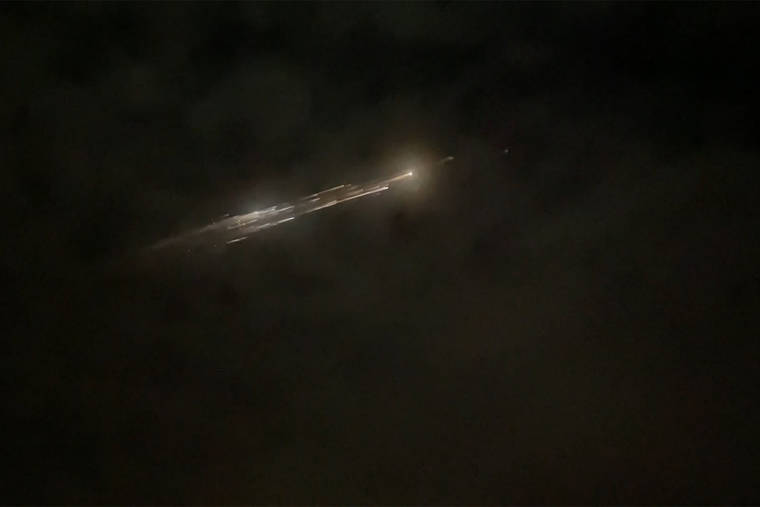 ROMAN PUZHLYAKOV VIA AP
                                In this image taken from video provided by Roman Puzhlyakov, debris from a SpaceX rocket lights up the sky behind clouds over Vancouver, Wash. Thursday evening, March 25. The remnants of the second stage of the Falcon 9 rocket left comet-like trails as they burned up upon re-entry in the Earth’s atmosphere according to a tweet from the National Weather Service.