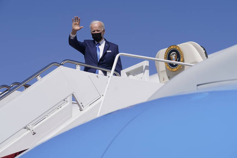 ASSOCIATED PRESS
                                President Joe Biden waves as he boards Air Force One at Andrews Air Force Base, Md., today.