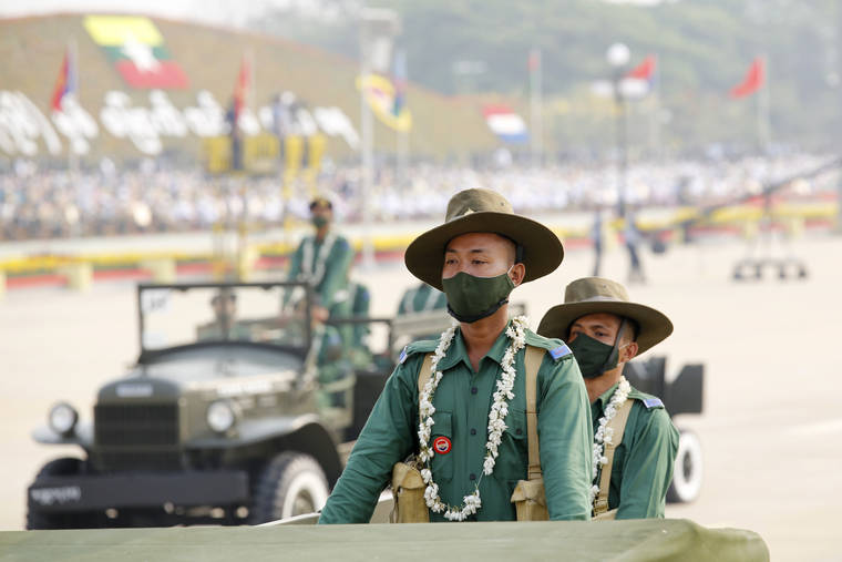 ASSOCIATED PRESS
                                Military personnel participate in a parade on Armed Forces Day in Naypyitaw, Myanmar, Saturday.