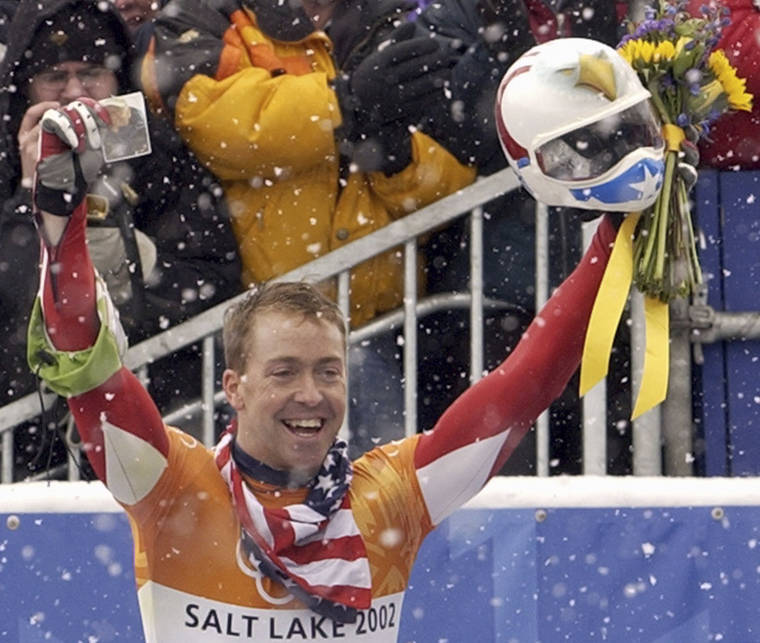 ASSOCIATED PRESS
                                Jimmy Shea of the United States held a photograph of his grandfather, in Feb. 2002, as he celebrated his gold medal-winning run after the men’s skeleton final at the Salt Lake City Winter Olympics in Park City, Utah. Shea was charged with sexual abuse of a child in Utah.