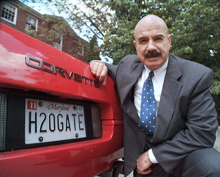 ASSOCIATED PRESS / 1997
                                G. Gordon Liddy kneels next to his Corvette outside the Fairfax, Va., radio station where he broadcasts his syndicated radio talk show.