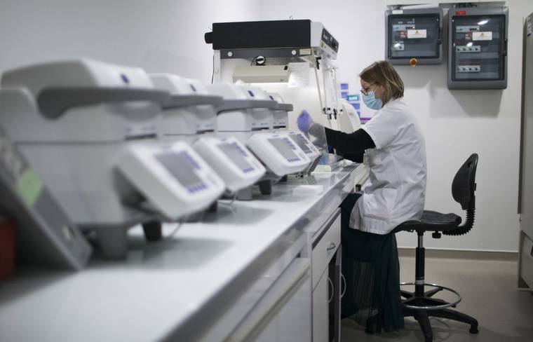 ASSOCIATED PRESS
                                Microbiologist Marielle Bedotto-Buffet prepared samples, Jan. 13, at the University Hospital Institute for Infectious Diseases in Marseille, southern France, to study the highly contagious COVID-19 variant that has been discovered in the U.K.