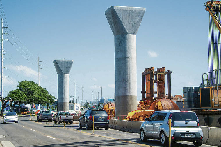 CRAIG T. KOJIMA / CKOJIMA@STARADVERTISER.COM
                                The Honolulu rail project is now expected to be completed in 10 years. Construction continued in Kalihi on Wednesday.