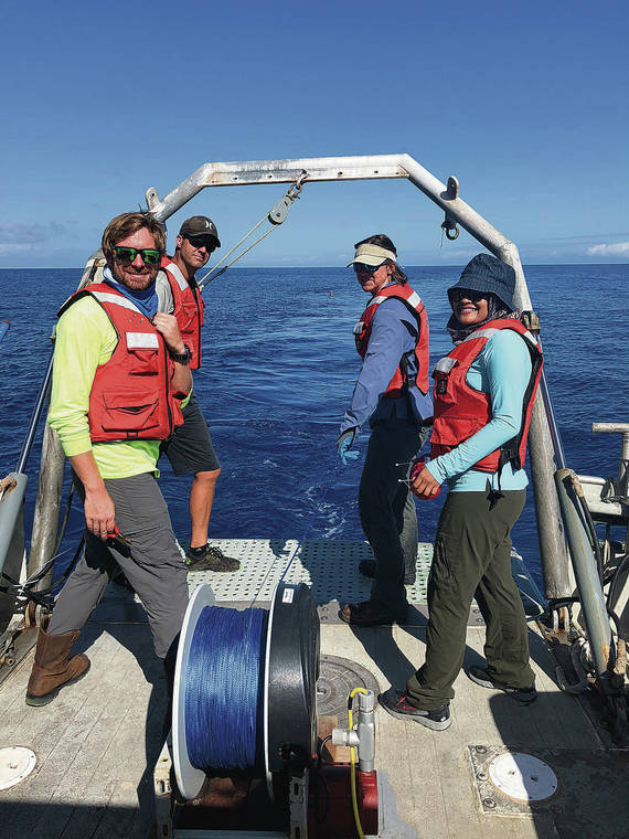 COURTESY UNIVERSITY OF HAWAII
                                Researchers Brendan Hunter, left, Jason Magalen, Dallas Sherman and Khaira Ismail tow electromagnetic imaging technology that mapped out freshwater plumes in the ocean for the first time.