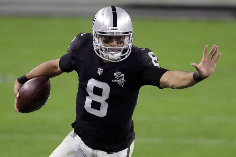 ASSOCIATED PRESS
                                Las Vegas Raiders quarterback Marcus Mariota ran against the Los Angeles Chargers in overtime of a game, Dec. 17, in Las Vegas. Mariota has agreed to a one-year deal to stay with the Las Vegas Raiders for 2021.